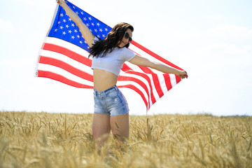 Woman in jeans shorts with an American flag