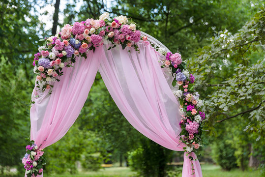 Pink wedding altar arch decoration in the garden