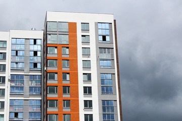 The facade of a high-rise residential building. Beautiful design and architecture.

