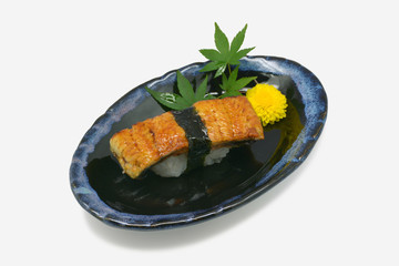 Unagi sushi in white plate on white background