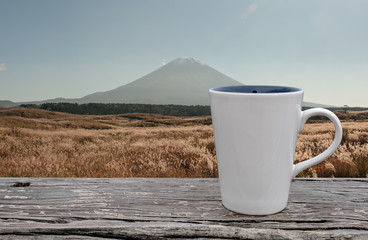 Obraz premium cup of coffee on abstract nature background