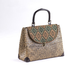Wicker women handbag decorated with thai fabric style isolated