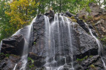 Obraz premium The waterfall on mountains in Harz, Germany.