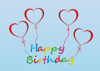 Balloons in the shape of heart bandaged with ribbon and bow