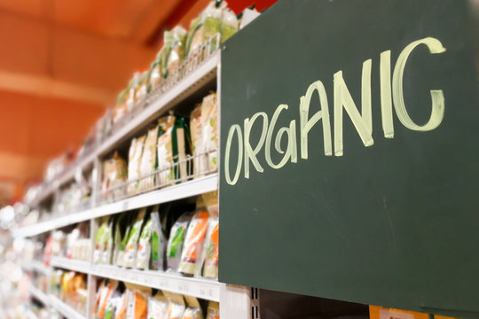 Organic Food Signage On Modern Supermarket Grocery Aisle