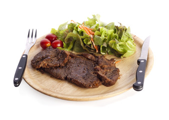 grilled beef steaks with spices isolated on white background