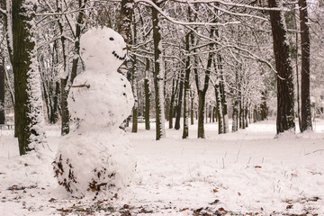 Snowman in winter melting