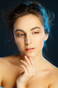 Beauty portrait of young pretty woman in studio. Face care concept.