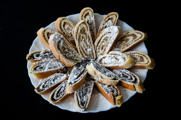 Poppy Strudels in the Plate with black background