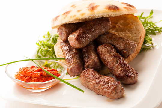photo of Cevapi, cevapcici, traditional  Balkan food - delicius minced meat