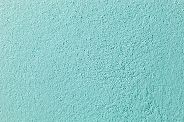 Light green cement wall background.