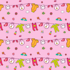 Seamless pattern with cute baby clothes.