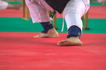 Man in white kimono training karate