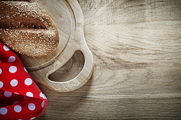 Bread chopping board tablecloth on wooden background