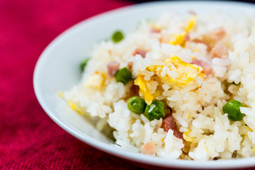 Homemade Chinese fried rice with vegetables and fried eggs