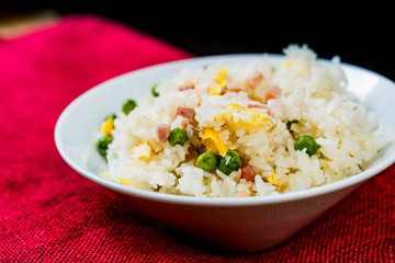 Homemade Chinese fried rice with vegetables and fried eggs
