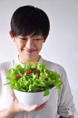 Young Woman Looking at her Salad Bowl