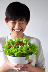 Young Woman Smiling to her Healthy Salad