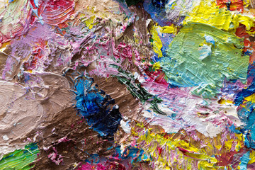 Palette with colorful mixed oil-paints texture