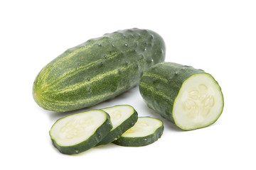 Fresh green cucumbers on a white background...