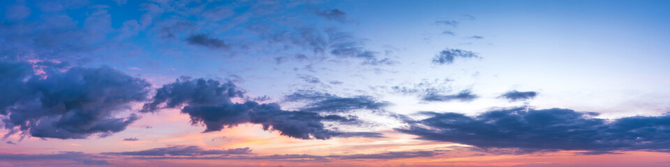 Naklejka na ściany i meble Vibrant panoramic sky on twilight time. Beautiful cloud. Panorama high resolution photograph.