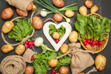 Big set organic food. Fresh raw vegetables. On a black chalkboard.