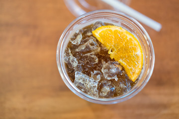 Ice americano with piece of orange