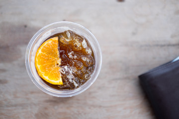 Ice americano with piece of orange