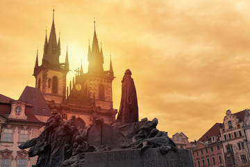 Church of Our Lady Tyn and Jan Hus statue from Old Town Square Staromestska Prague at sunset. Prague landmarks.