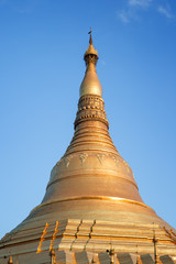 Fototapeta premium Gilded Shwedagon Pagoda in Yangon, Myanmar on a sunny day.