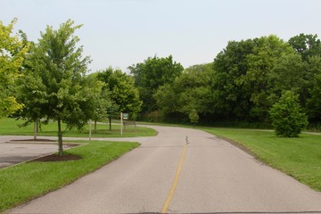 The curved road in the park on a cloudy day.