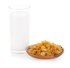 Cornflakes and milk on white background
