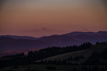 Background with Ukrainian Carpathian Mountains during the sunset in the Pylypets