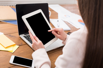 Business woman using tablet with blank screen