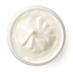 Cream in glass bowl isolated on white, top view