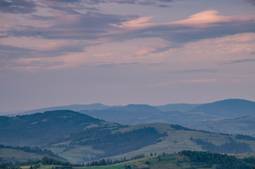 Background with Ukrainian Carpathian Mountains during the sunset in the Pylypets