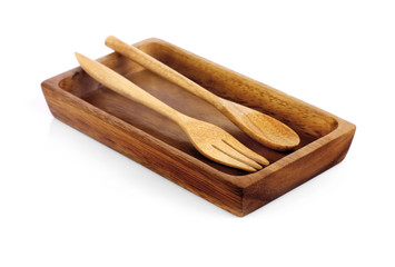 wooden plate and spoons forks on white background