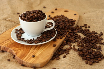 A cup full of coffee beans