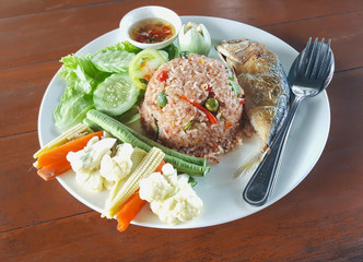 Focus at Chili Dips. The Nam Nam Prik Kapi or Shrimp Paste Chili Dips, Thai traditional dish served with crispy fried mackerel, local vegetables with streamed rice.