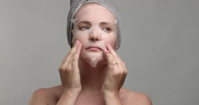 woman with a facial sheet mask on