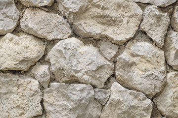 The background of the large stones of the old walls.