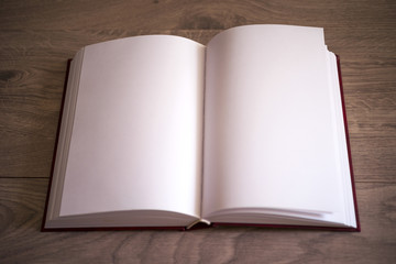 Open book on wooden background. Back to school.
