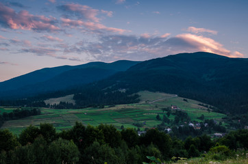 Background with Ukrainian Carpathian Mountains during the sunset in the Pylypets