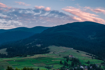 Obraz premium Background with Ukrainian Carpathian Mountains during the sunset in the Pylypets