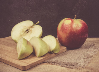 Fresh apple on a wooden background.