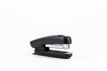 Black stapler isolated on white. Business and education background