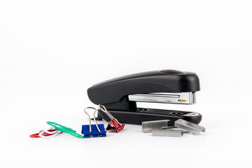 Black stapler isolated on white. Business and education background