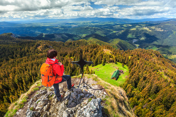 Sporty hiker woman on the top of mountain, Transylvania, Romania