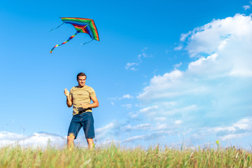 Cheerful guy having fun in the nature