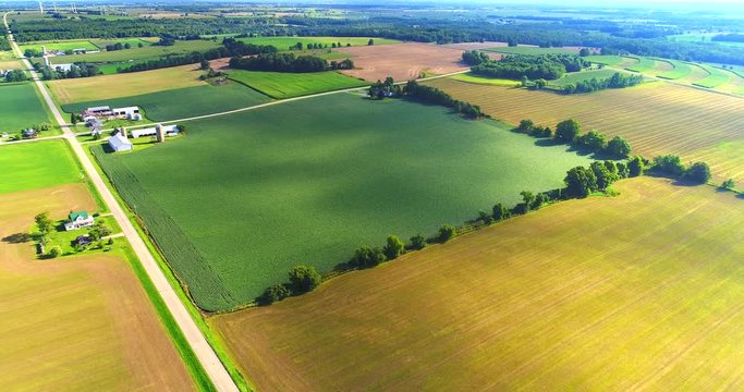 The multifaceted colors of Wisconsin fields and crops in late Summer, aerial view.
